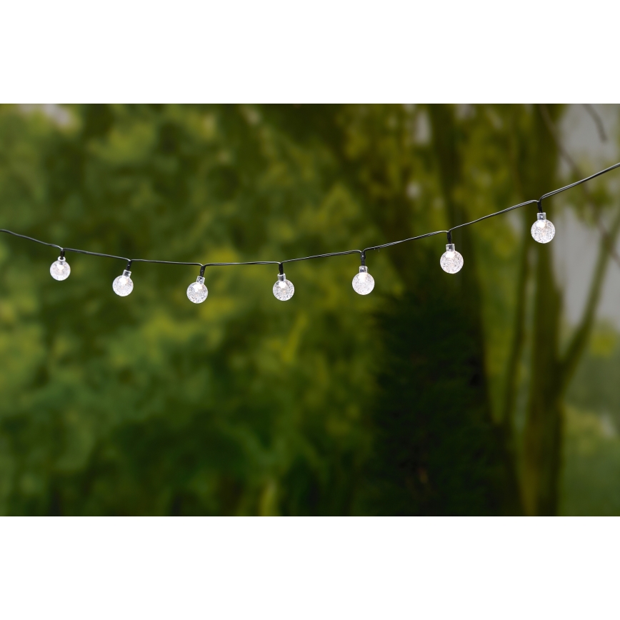 Grundig - LED Соларна верига 50xLED/8 функции 6,9m топло бяло