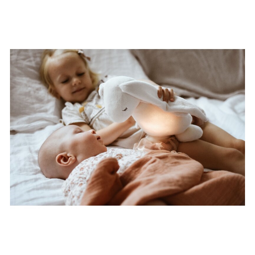 Moonie - Приятел за гушкане с мелодия и светлина 2.0 зайче organic роза